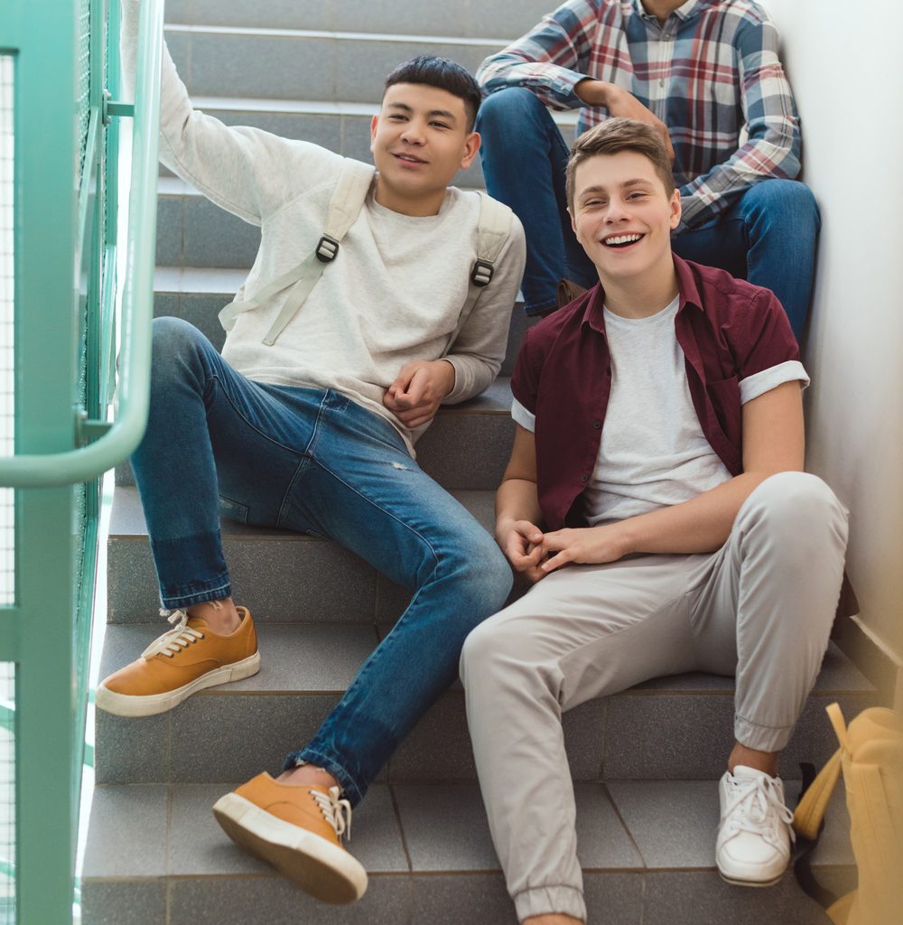 Teenage Schoolboys Sitting On Stairs At School And L4MN3UL 1000x1024